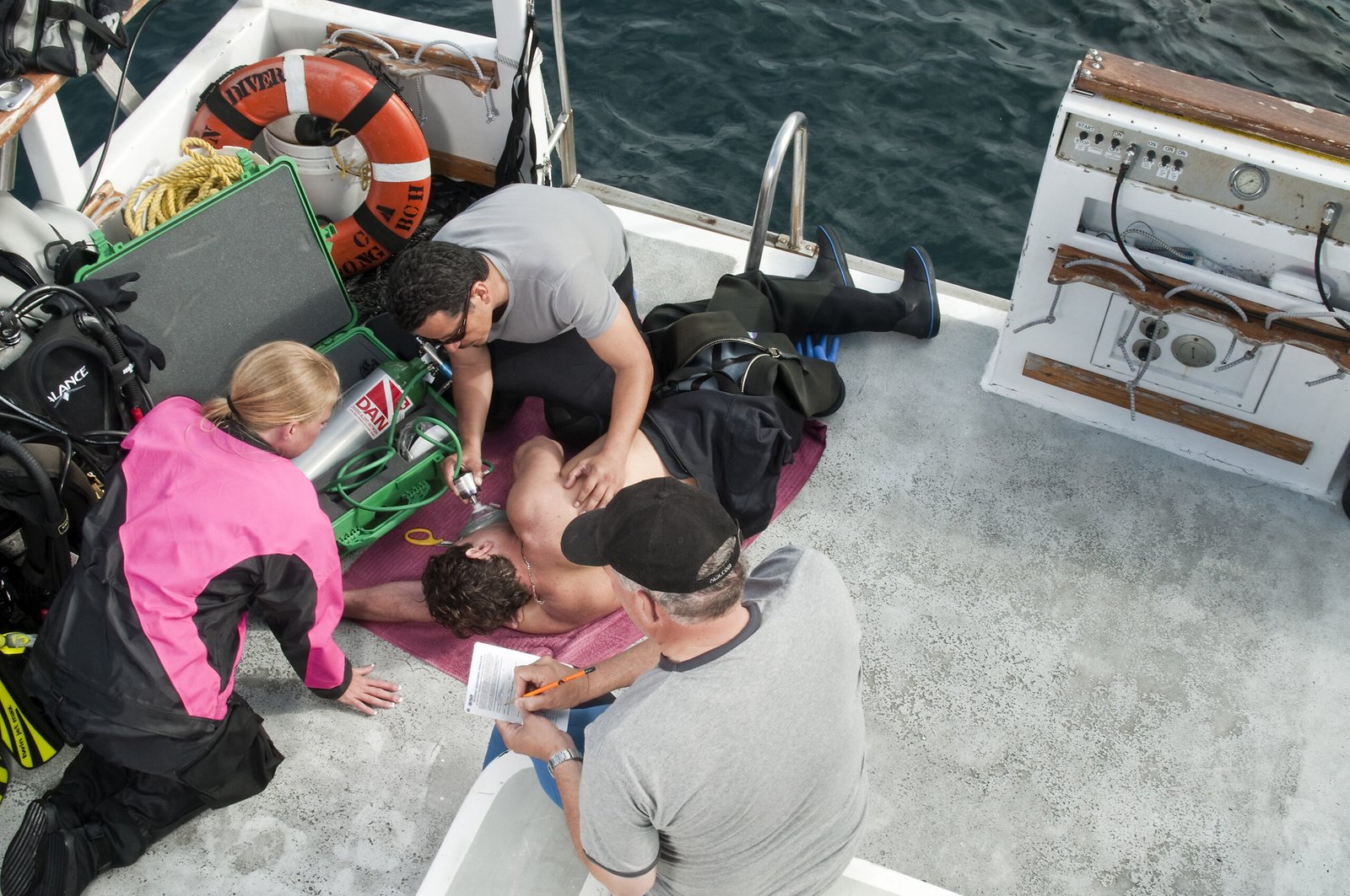 DYVUM Emergency Oxygen Provider practising oxygen administration on the boat