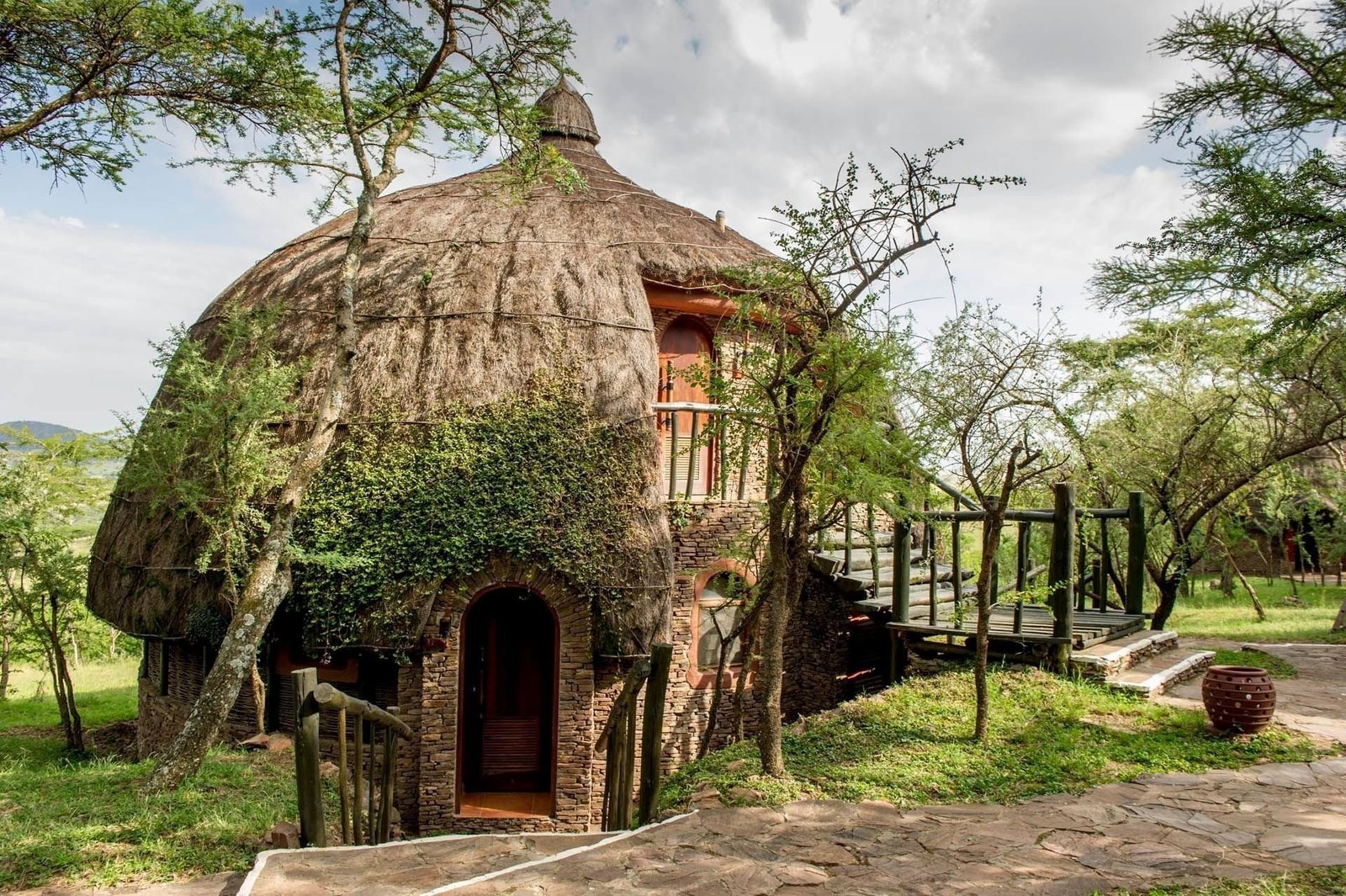 Thatched stone archway entrance, Serena Serengeti, Tanzania